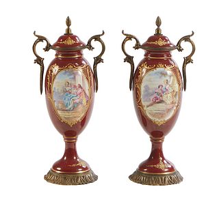 Pair of French Sevres Style Hand Painted Covered Porcelain Bronze Mounted Urn Garniture Urns, late 19th c., with gilt decoration on a magenta ground w