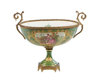 French Hand Painted Bronze and Porcelain Center Bowl, 20th c., with gilt decoration on a green ground, the interior with a painted floral bouquet, H.-