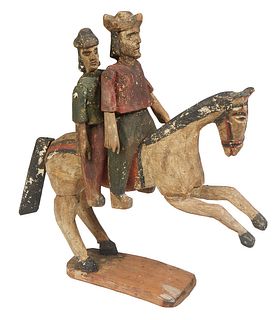 Carved Wood South American Figure, 19th c., of two men on a horse, in original paint, H.- 15 in., W.- 14 1/2 in., D.- 4 in. Provenance: from the Estat