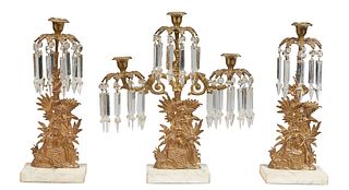 American Three Piece Brass and Crystal Girandole Set, 19th c., in the "Courting Couple" motif, consisting of a three light candelabra, hung with butto
