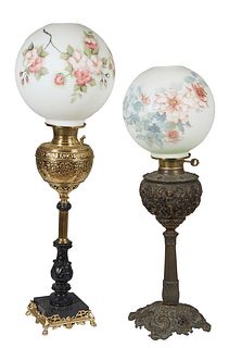 Two American Brass Oil Lamps, 19th c. with floral painted milk glass ball shades, electrified, one with a repousse bright brass grape bunch relief fon