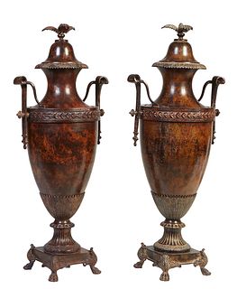 Large Pair of Patinated Bronze Covered Baluster Garniture Urns, 20th c., the lid with a three leaf handle over a sloping neck, to a relief leaf band a
