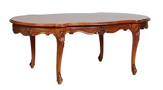 French Louis XV Style Carved Cherry Oval Dining Table, 20th c., the stepped parquetry inlaid tortoise top over an incised scalloped skirt, on scrolled