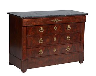 French Ormolu Louis Philippe Carved Mounted Walnut Marble Top Commode, 19th c., the figured black top over a long frieze drawer above three deep drawe
