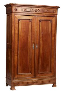 French Provincial Carved Walnut Double Door Armoire, late 19th c., the stepped canted corner crown over double paneled doors, above a bottom "secret" 