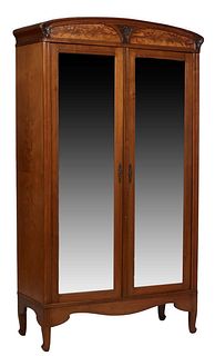 French Art Deco Carved Cherry Armoire, c. 1940, the arched top over double wide beveled mirror doors, on a plinth base on cabriole legs, H.- 87 in., W