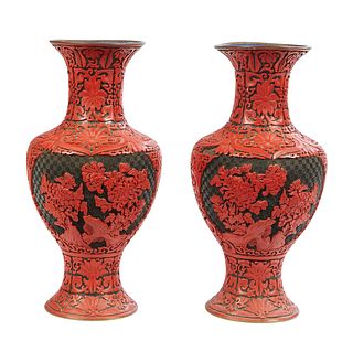 Pair of Chinese Cinnabar Vases, 20th c., the red cinnabar over blue enamel vases cut to black with designs of chrysanthemums and stylized lotus scroll