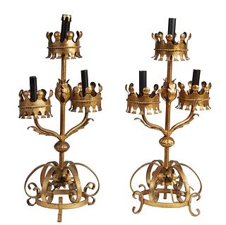 Pair of Gilt Iron Three-Light Electrified Candelabra Lamps, 20th c., with crown form bobeches, the center light raised over two scrolled arms mounted 