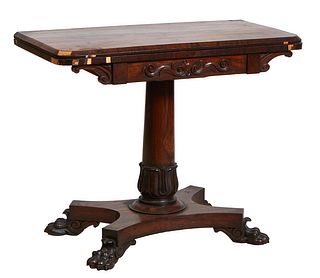 English Regency Rosewood Games Table, 19th c., the rounded corner top opening to a circular baize inset gaming surface, on a tapered cylindrical pedes