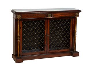 French Carved Rosewood Marble Top Server, early 20th c., the inset figured white marble over two frieze drawer and two setback brass grill cupboard do