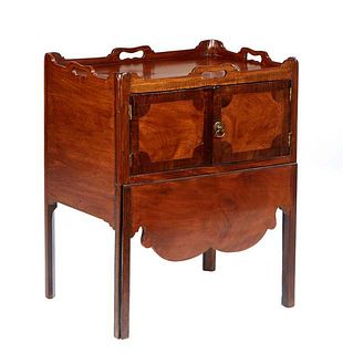 English Inlaid Carved Mahogany Bedside Commode, early 20th c., the galleried top with four hand holes, over double cupboard doors and a lower gilt too