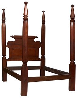 American Carved Mahogany Four Poster Bed, late 19th c., the headboard with an octagonal rolling pin top, flanked by tapered octagonal and block posts,