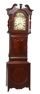 English Georgian Carved Mahogany Tallcase Clock, 19th c., the broken arch crown over a glazed door enclosing a hand painted iron time and strike clock
