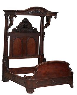 American Carved Mahogany Rosewood Grained Half Tester Bed, 19th c., the arched floral and grape carved canopy with scrolled brackets, to octagonal and