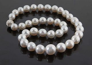 Stand of Thirty-Seven Graduated Cultured White Tahitian Pearls, ranging from 10-14mm, with a 14K white gold ball clasp, L.- 18 1/2 in., with appraisal