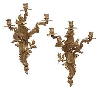 Pair of Louis XV Style Gilt Bronze Three Light Sconces, late 19th c, the scroll and leaf form back plate issuing three relief arms with leaf form bobe