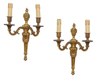 Pair of Louis XVI Style Gilt Bronze Two Light Sconces, 20th c., the torch form backplate issuing two scrolled arms with beaded bobeches and reeded can