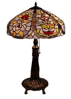 Tiffany Style Leaded Stained Glass Table Lamp, 20th c., the scalloped leaded shade with floral decoration, on a brass patinated tree form base, on fou