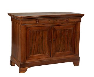 French Provincial Louis Philippe Carved Walnut Sideboard, 19th c., the reeded edge rounded corner top over two frieze drawers above double cupboard do