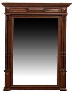 French Henri II Style Carved Walnut Overmantel Mirror, late 19th c., the stepped crown over a setback wide beveled plate, flanked by double reeded col