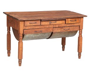 French Provincial Carved Cherry Grain Table, 19th c., the rectangular top with a wide skirt with a center pull out slide and five drawers, the bottom 