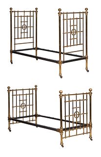 Pair of Brass Plated Iron Beds, early 20th c., the headboard with vertical and horizontal spindles with a central circular brass mount, on ball feet, 