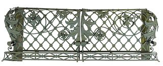 Unusual Wrought Iron Strapwork Balcony Railing, New Orleans, 20thc., with a planter form top rail over bowed sides with floral relief X-form strapped 