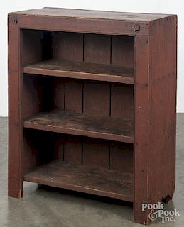 Pennsylvania painted pine cupboard, 19th c., retaining the original red surface, 37'' h., 31'' w.