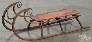 Child's painted wood sled, 19th c., with remains of original red paint and scrolled runners, 42'' l.