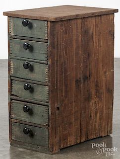 Primitive drawered cabinet, early 20th c., made from shipping crates, 18 1/2'' h., 9'' w.