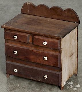 Child's pine doll dresser, 19th c., 14 1/2'' h., 13 1/2'' w. Provenance: Barbara Hood's Country Store