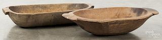 Two primitive wood trenchers, early 20th c., 20'' w. Provenance: Barbara Hood's Country Store