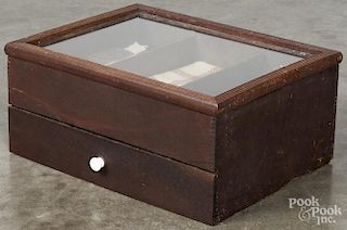 Country store counter top display case, ca. 1900, with a hinged lid, over a single width drawer