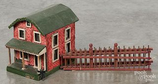 Child's paper covered wood doll house, ca. 1900, with electricity, 12'' h., 8 1/2'' w.