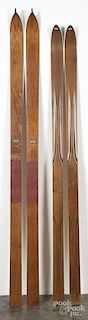 Two pairs of Northwood wooden skis, ca. 1900, with nice stag decal labels, 72'' l. and 77'' l.