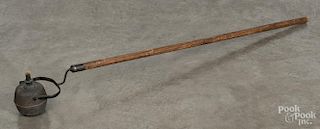 Tin gimbaled parade torch, 19th c., mounted to a pole, 49'' l.