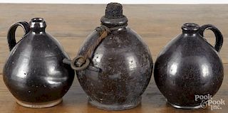 Three New England redware ovoid jugs, early 19th c., tallest - 7''.