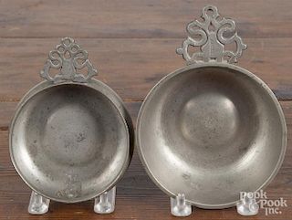 Two New England pewter porringers, 19th c., the larger bearing the touch of Thomas Danforth