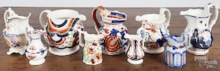 Eight Gaudy Welsh pitchers and creamers, patterns to include Galleon, Rainbow, Pagoda, Rhiwderyn