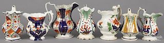 Seven Gaudy Welsh pitchers, patterns to include Conway, Capel Curig, Gardenia, Coed-Cay, Cardiff