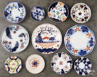 Sixteen Gaudy Welsh plates and saucers in various patterns.