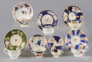 Seven Gaudy Welsh tea cups and saucers, patterns to include Columbine, Lattice, Sprays, Grape