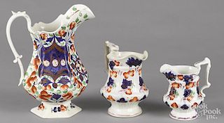 Two Gaudy Welsh graduated pitchers in the Grape pattern, 7 1/2'' h., 6'' h.