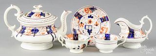 Gaudy Welsh partial tea service in the Buckle pattern, to include a teapot, a creamer, two tea cups