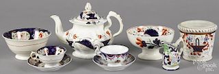 Nine pieces of Gaudy Welsh in the Basket of Flowers pattern, to include a flower pot, a teapot
