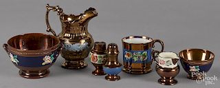 Copper lustreware, to include a mug, a bowl, a pitcher, a two-handled bowl, a creamer, and casters.