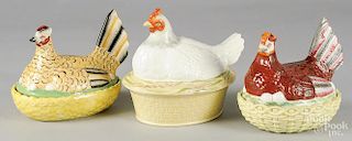 Three Staffordshire hens on nests, 7 1/2'' h., 7 1/2'' h., and 8 3/4'' h.