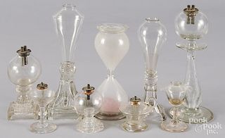 Eight colorless glass fluid lamps, 19th c., tallest - 9 1/4'', together with a sand timer, 7 3/4'' h.