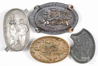 Four metal naughty ashtrays, early 20th c., to include cast brass, spelter, aluminum, and pewter