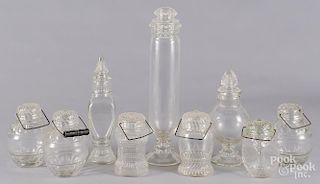 Six colorless glass food jars, ca. 1900, with threaded glass lids and bail handles